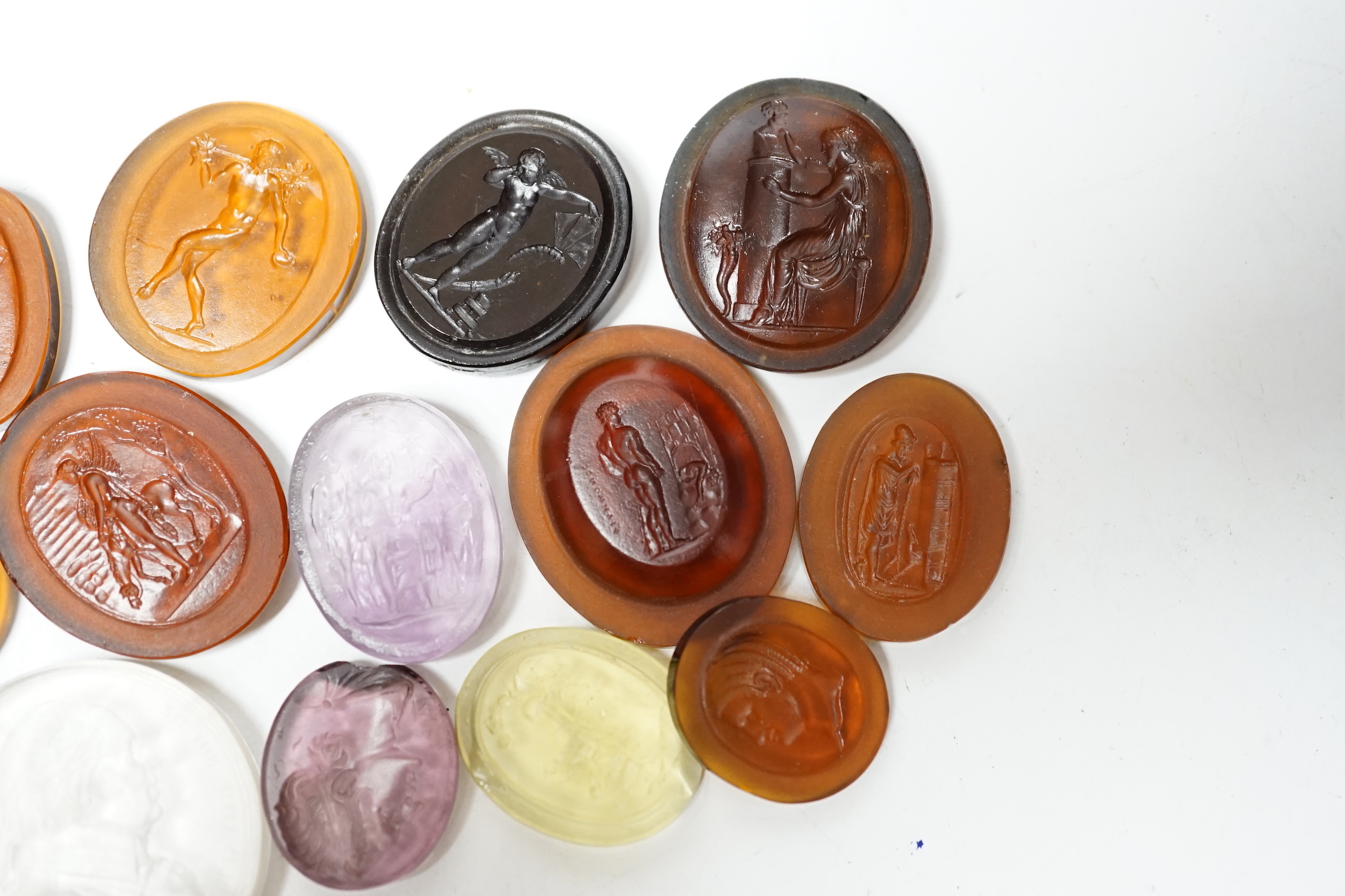 Fourteen 19th century intaglio glass matrices, largest approx. 3cm diameter